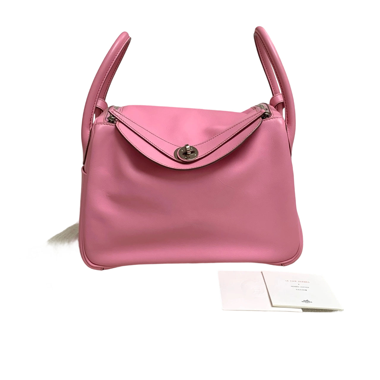 Front view of an authentic Hermès Lindy 30 bag in Rose Azalée pink Taurillon Clemence leather with silver Palladium hardware