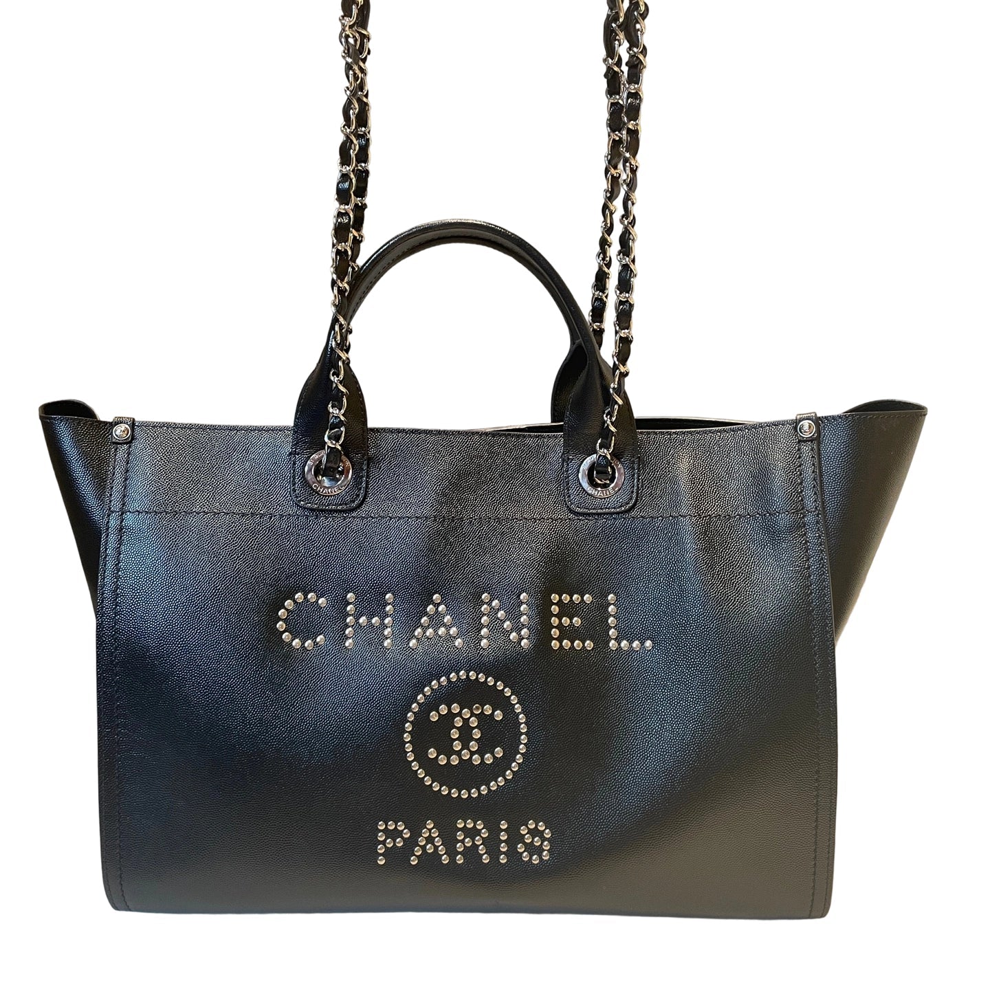 Chanel Deauville tote bag in black grained calfskin featuring silver metal studded CHANEL PARIS logo and CC emblem