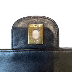 Timeless Vintage Icon: CHANEL Black & Gold CF Chain Bag