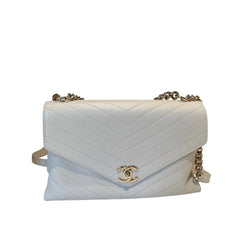 Authentic Chanel white Chevron V-stitch envelope flap bag in calfskin leather with gold-tone CC logo and chain strap