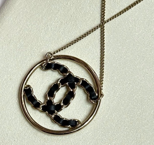 Chanel Gold Tone Circle Necklace with Black Leather Woven Interlocking CC Logo
