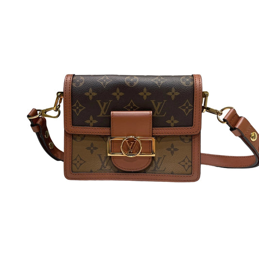 Louis Vuitton Dauphine Mini Monogram Reverse canvas shoulder bag with gold LV circle lock, front view, 20cm size