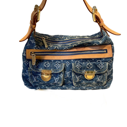 Authentic Louis Vuitton Monogram Denim Baggy PM handbag in blue washed denim with tan vachetta leather trim and gold-tone hardware