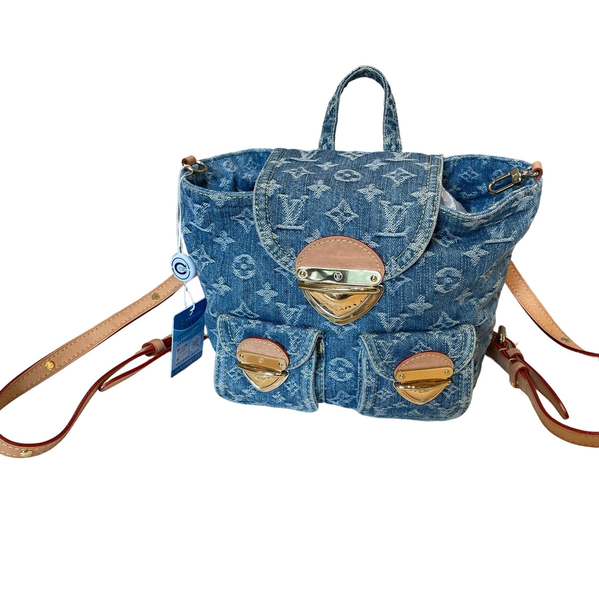 Front view of a rare Louis Vuitton Monogram Denim Mini Backpack with blue washed denim and tan vachetta leather trim