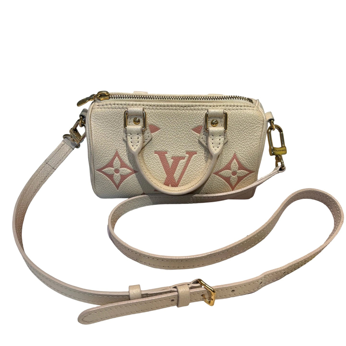 Louis Vuitton Nano Speedy in cream Monogram Empreinte leather with pink Giant Monogram pattern, front view with strap