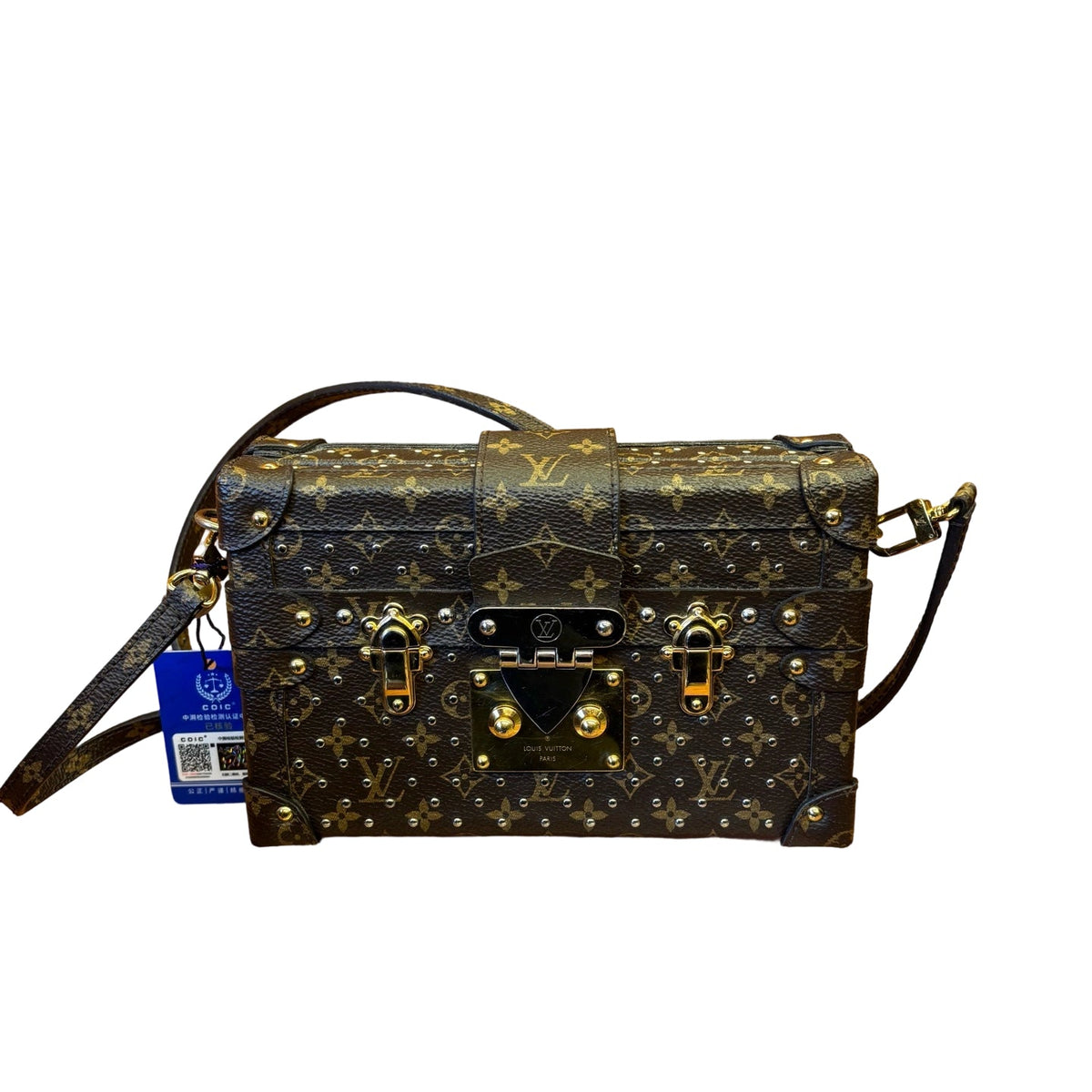 Front view of authentic Louis Vuitton Petite Malle box bag in monogram canvas with decorative gold and silver studs and S-lock closure